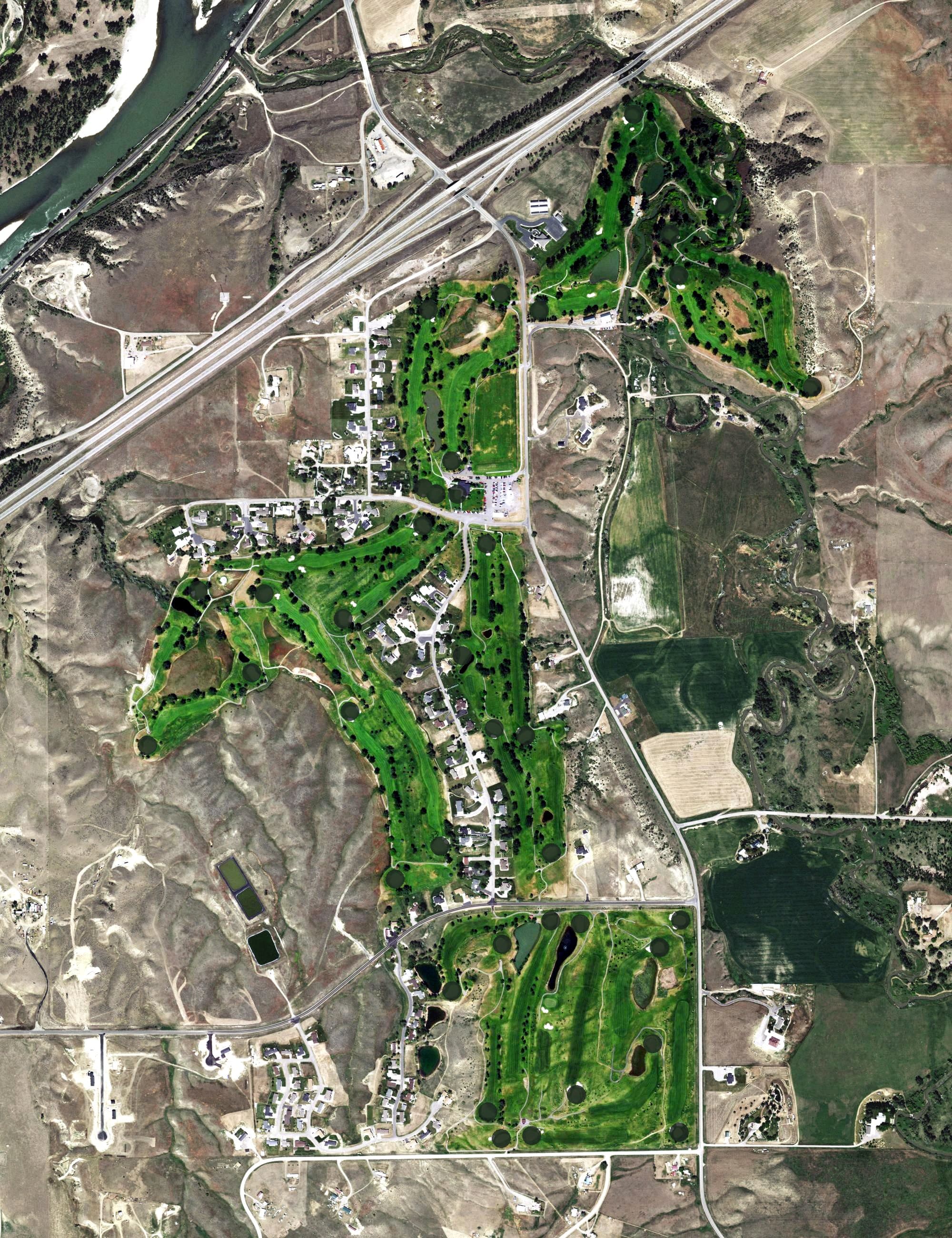 Aerial view of Huntley Golf Course, MT, with its hole routing marked