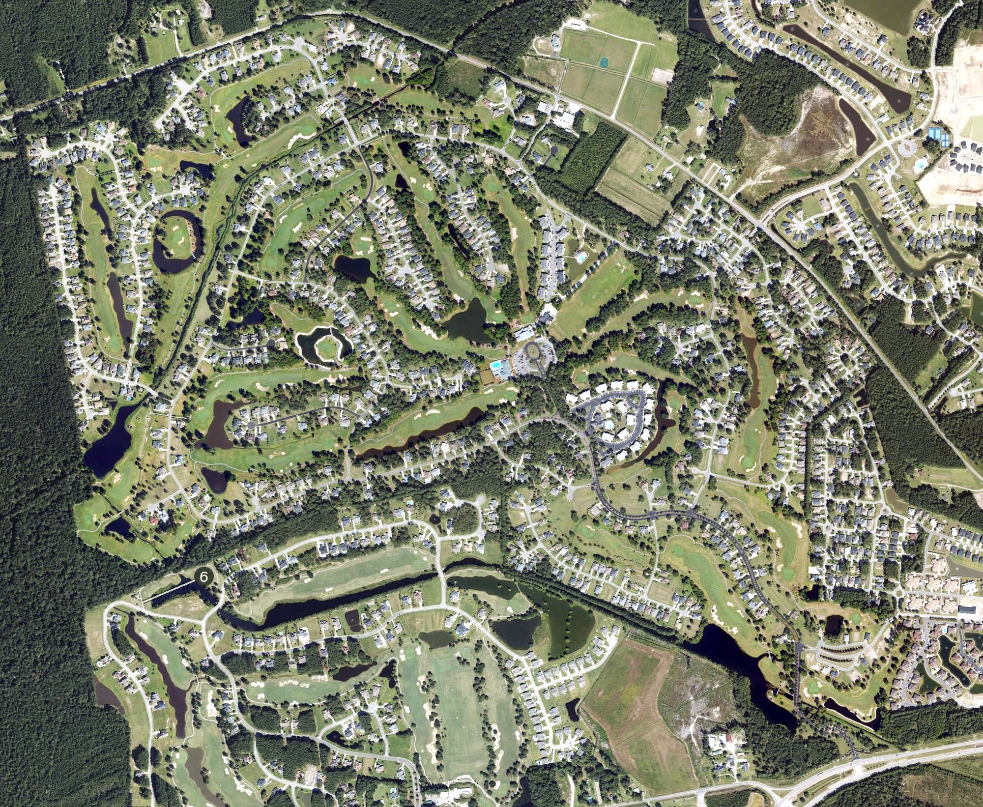 Aerial view of Brunswick Plantation & Golf Resort, NC, with its hole routing marked
