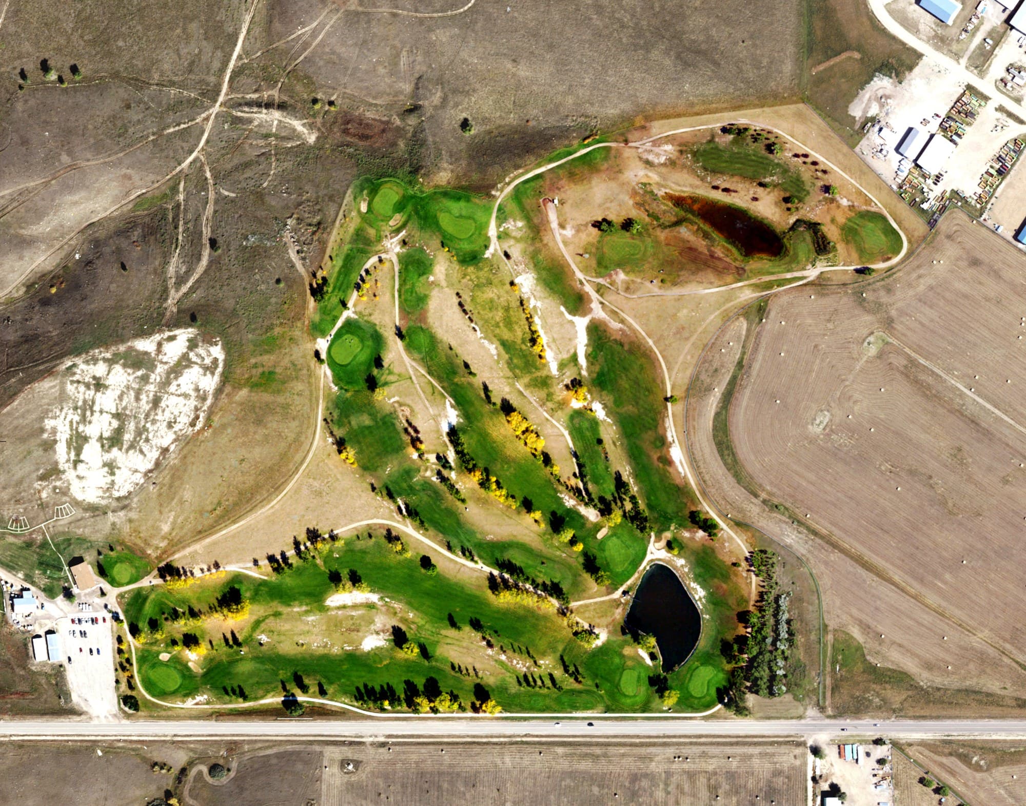 Aerial view of Williston Municipal Golf Course, ND, with its hole routing marked