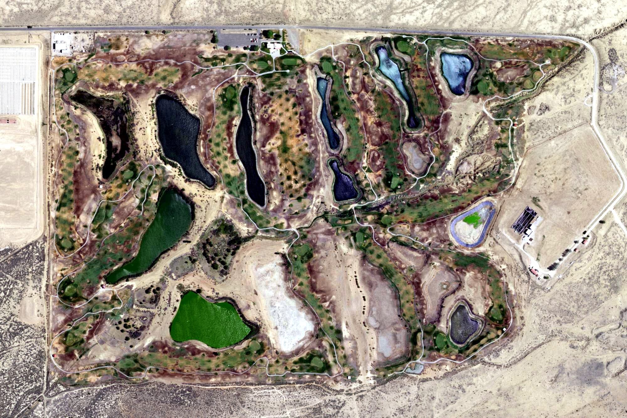 Aerial view of Coyote Del Malpais Golf Course, NM, with its hole routing marked