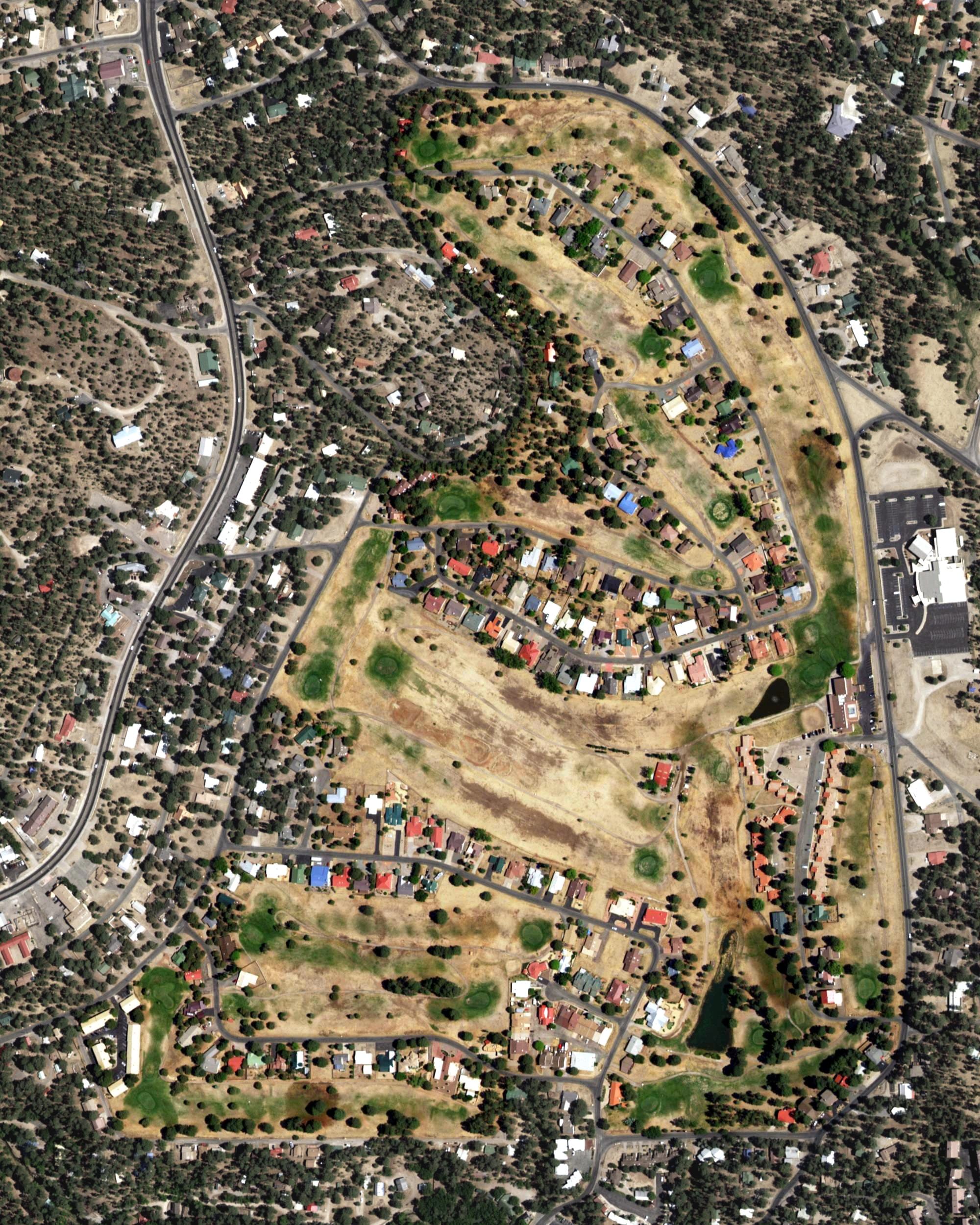 Aerial view of Cree Meadows Country Club, NM, with its hole routing marked