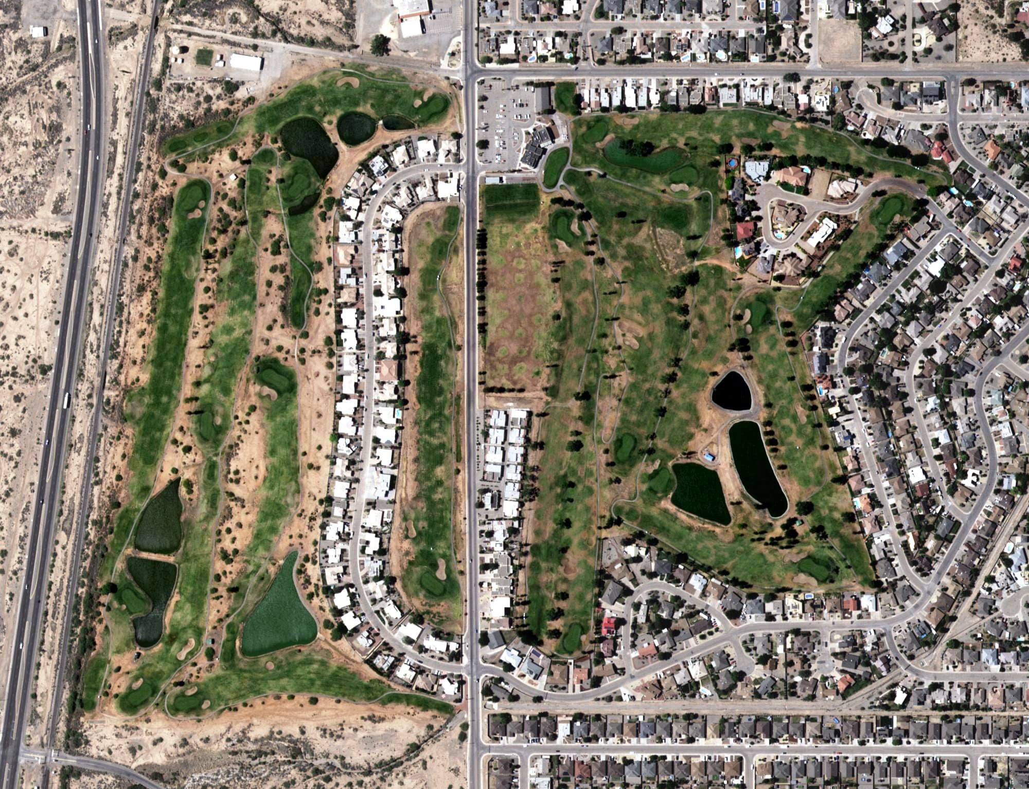 Aerial view of Desert Lakes Golf Course, NM, with its hole routing marked