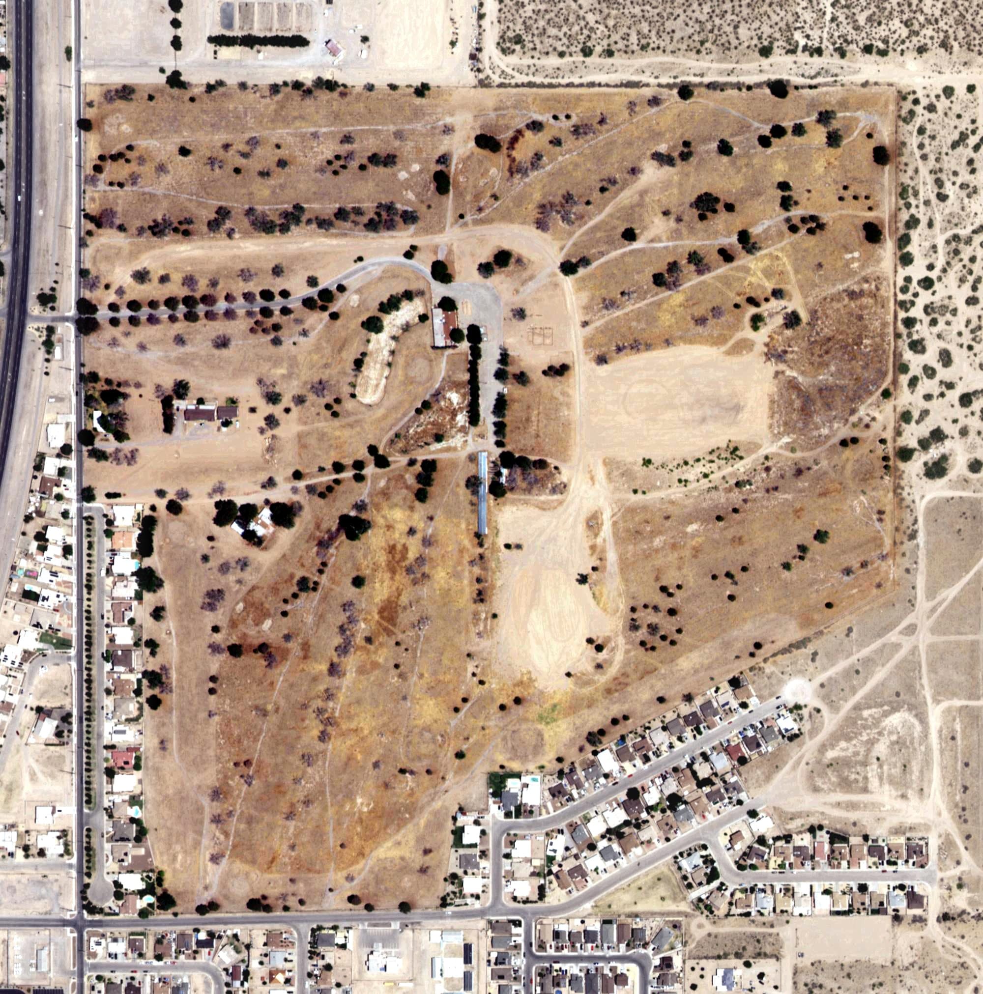 Aerial view of Dos Lagos Golf Course, NM, with its hole routing marked