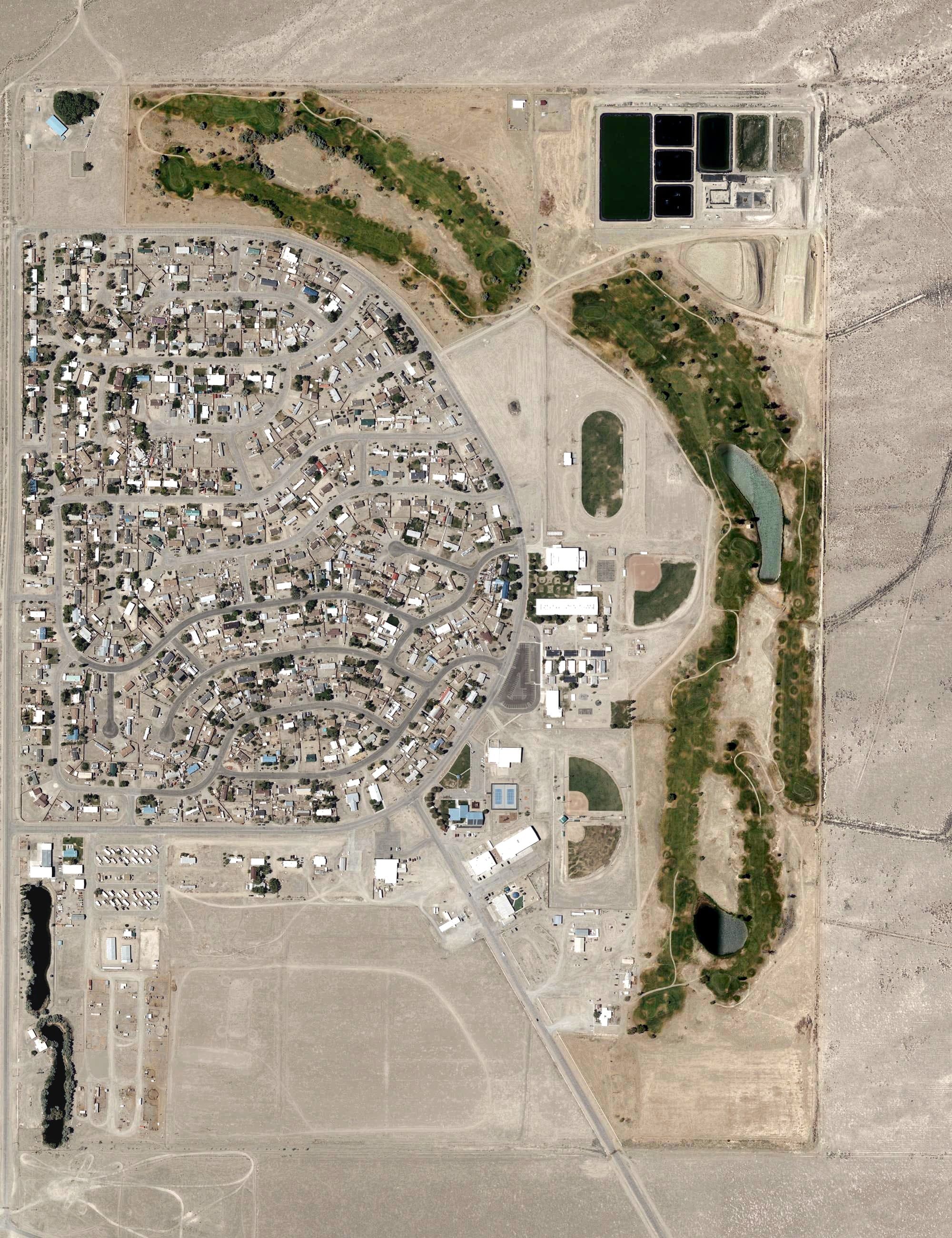 Aerial view of Round Mountain Golf Course, NV, with its hole routing marked