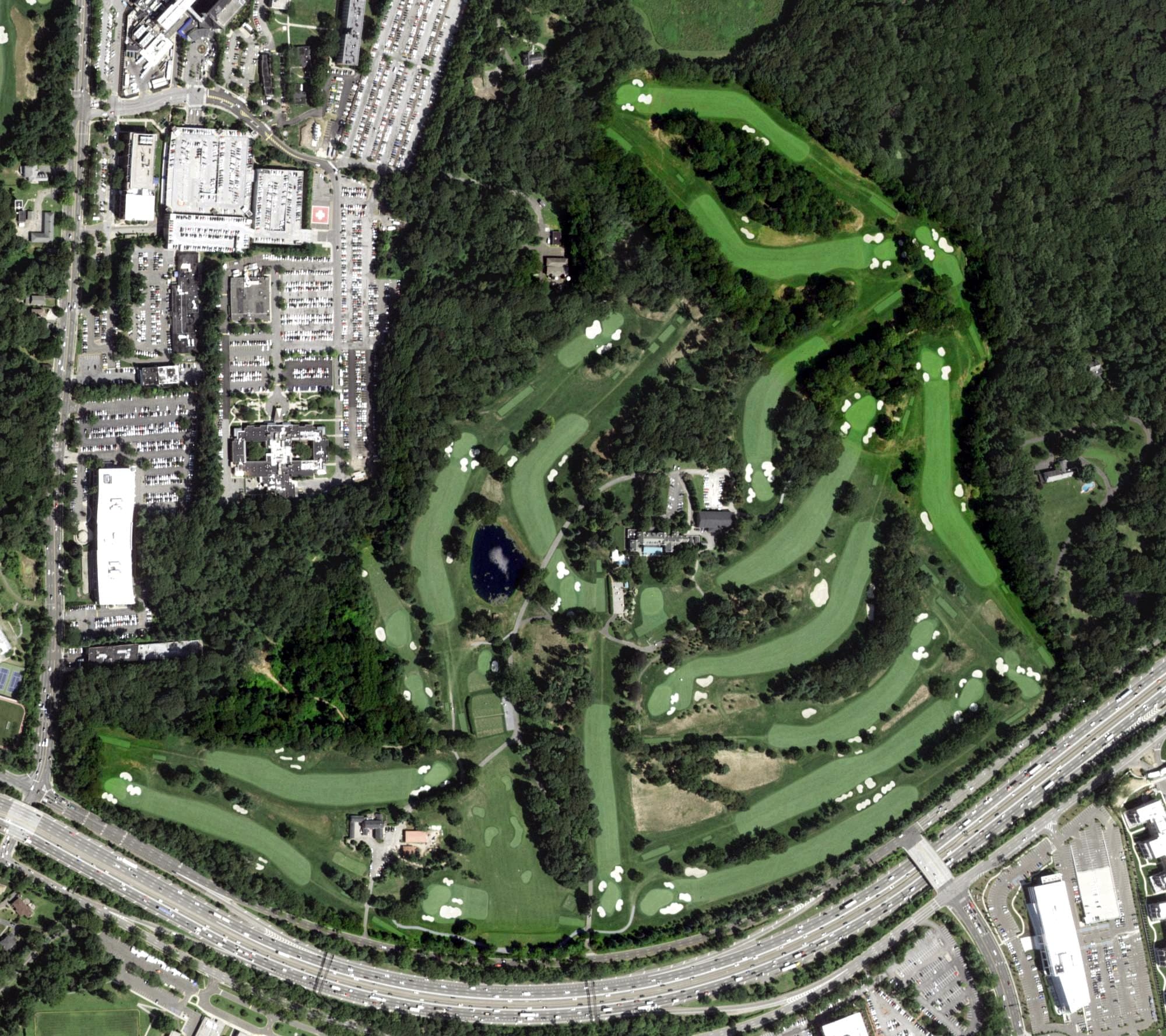 Aerial view of Deepdale Golf Club, NY, with its hole routing marked