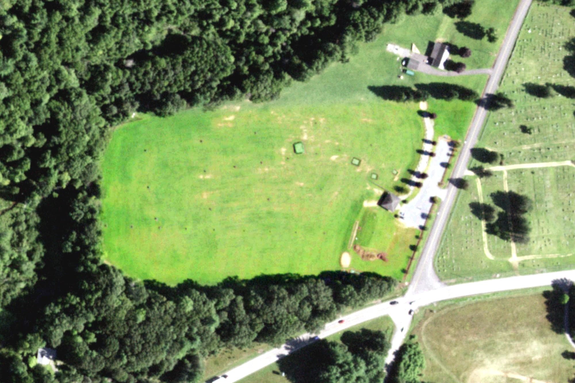Aerial view of Golf World, NY, with its hole routing marked