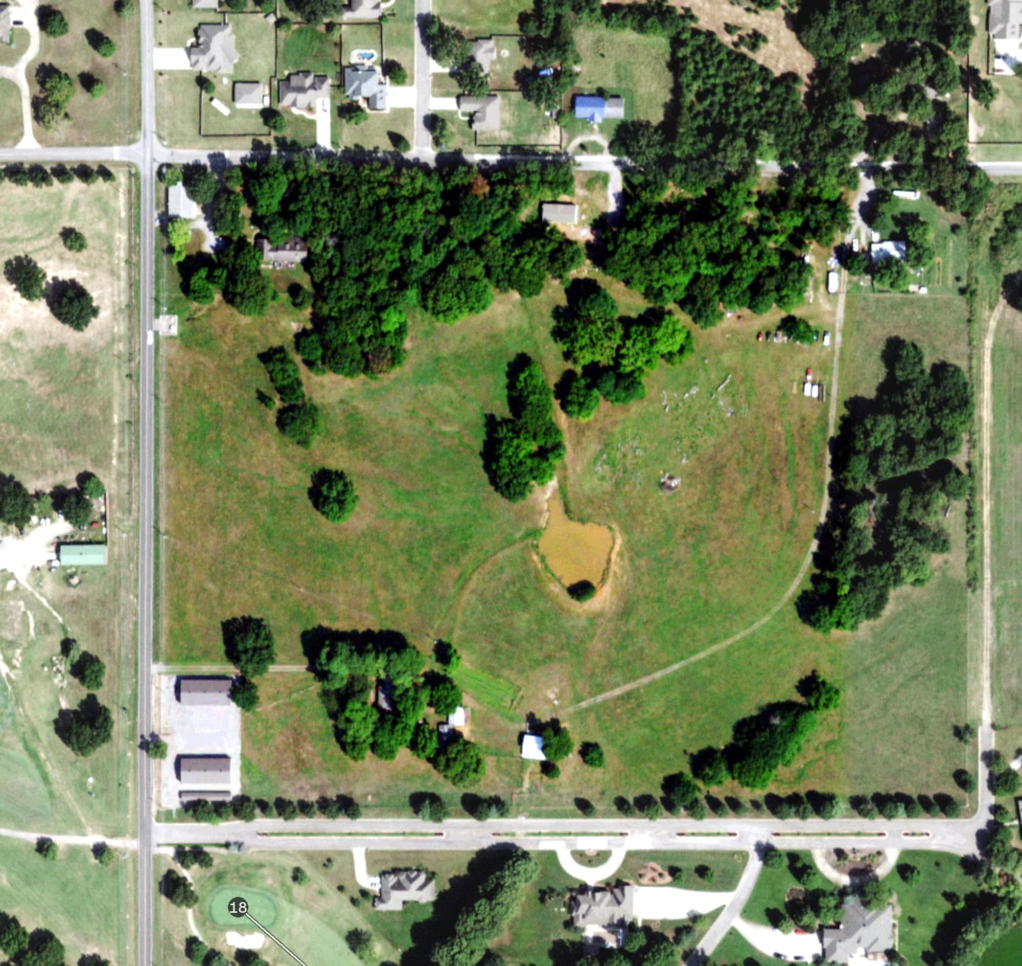 Aerial view of Cherokee Springs Golf Club, OK, with its hole routing marked