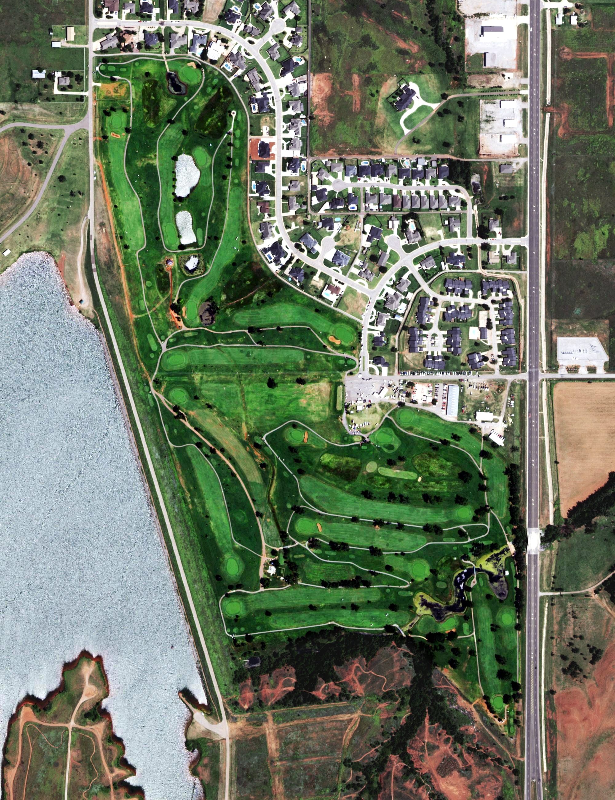 Aerial view of Elk City Golf and Country Club, OK, with its hole routing marked