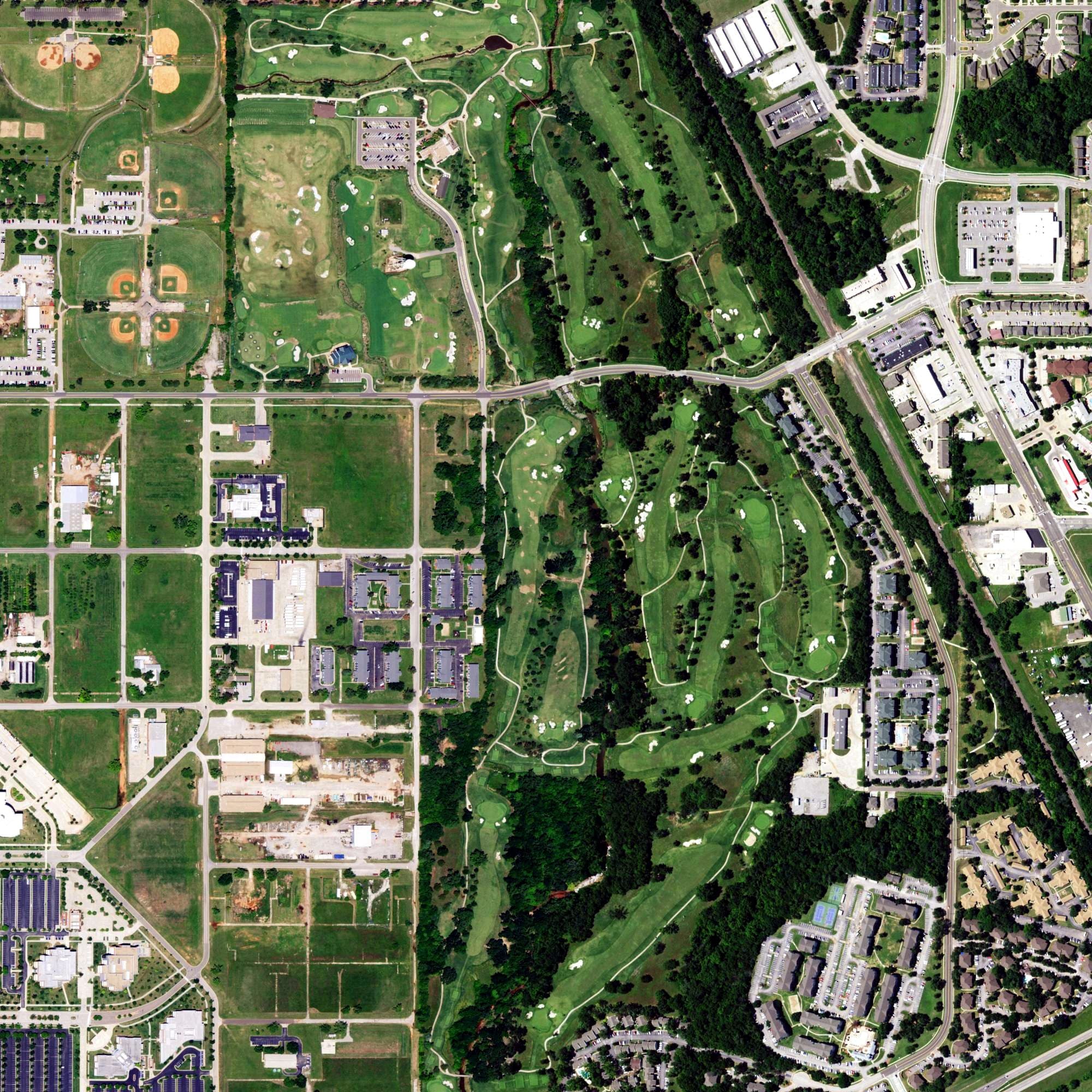 Aerial view of Jimmie Austin Golf Club, OK, with its hole routing marked