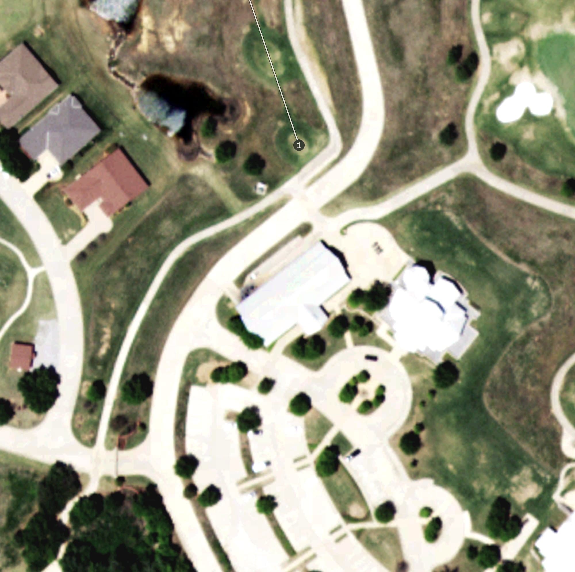 Aerial view of Territory Golf & Country Club, OK, with its hole routing marked
