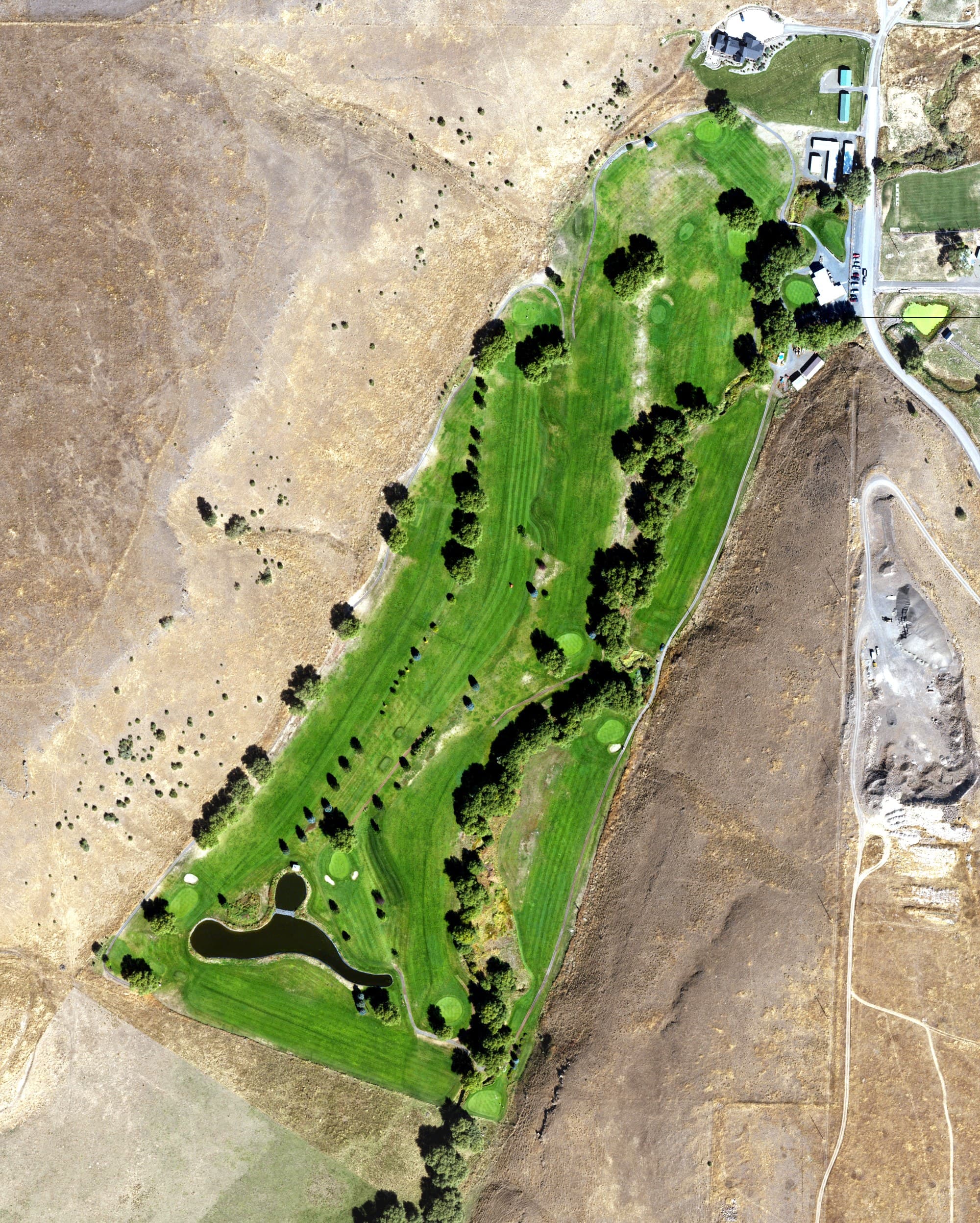 Aerial view of Alpine Meadows Golf Course, OR, with its hole routing marked