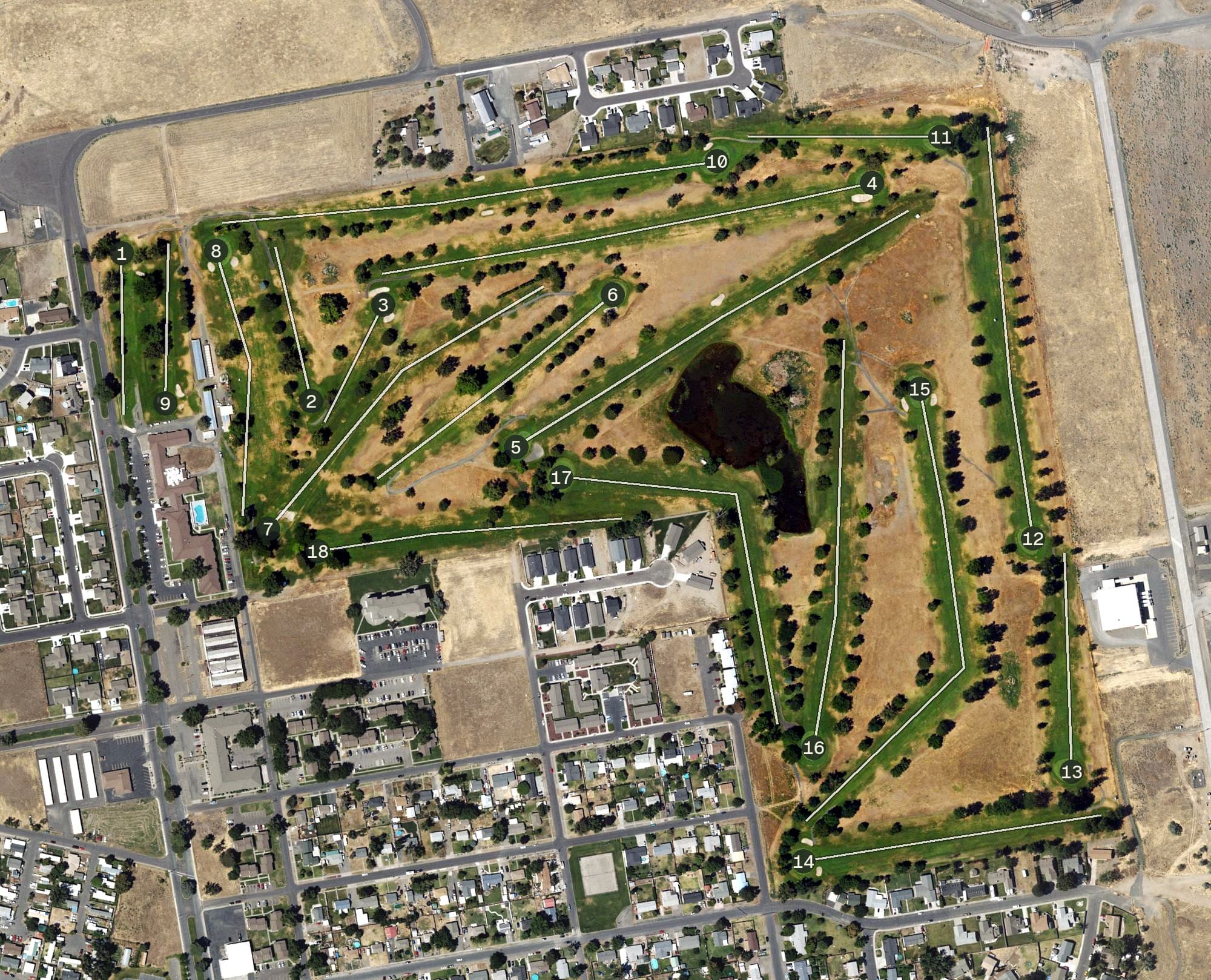 Aerial view of Big River Golf Course, OR, with its hole routing marked