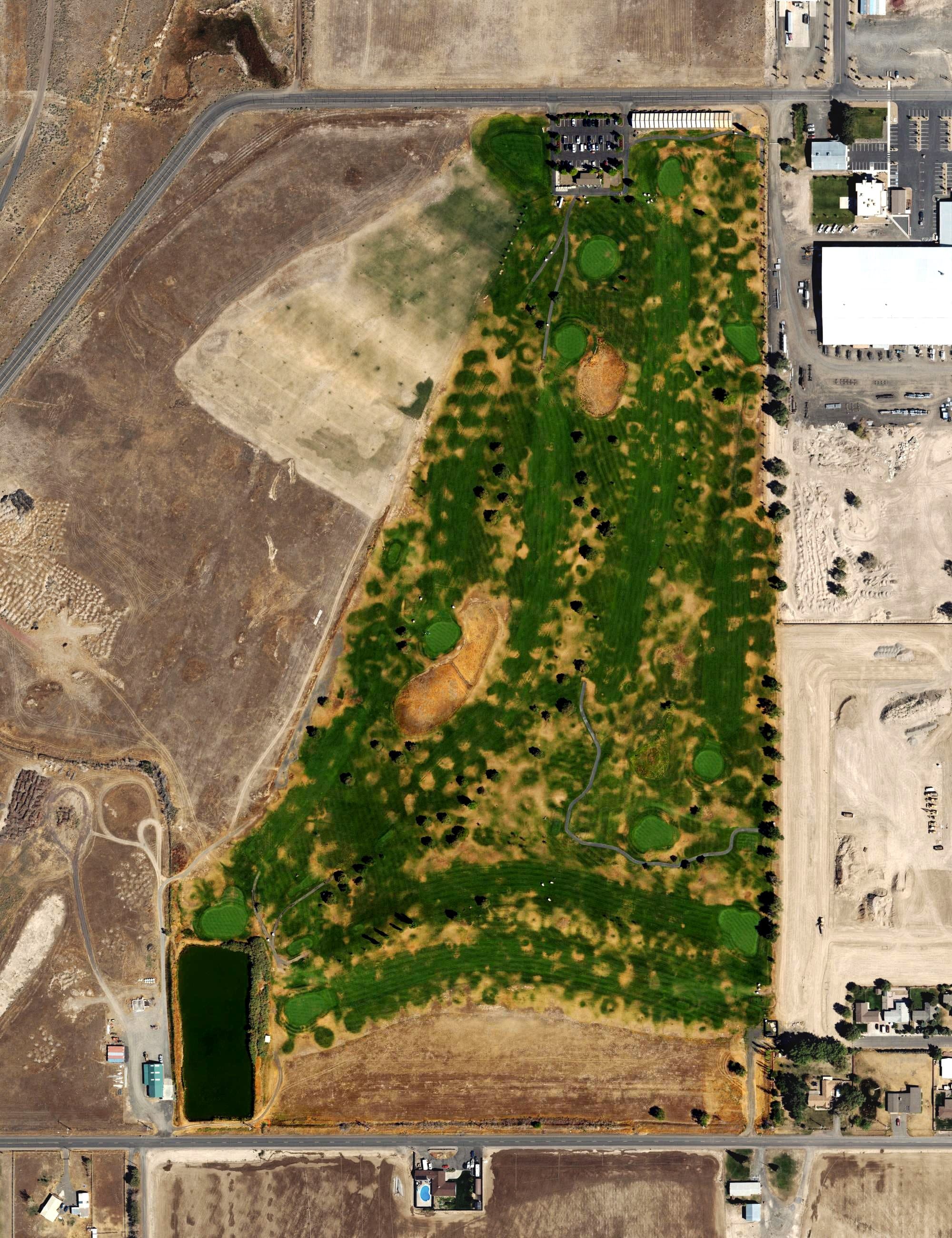 Aerial view of Desert Peaks Golf Course, OR, with its hole routing marked