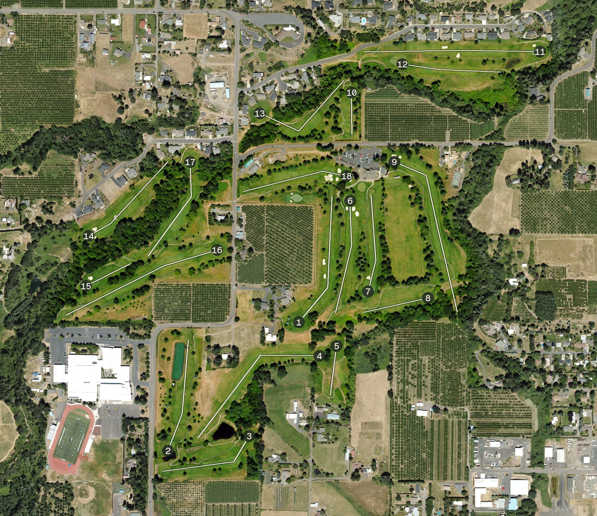 Aerial view of Indian Creek Golf Course, OR, with its hole routing marked