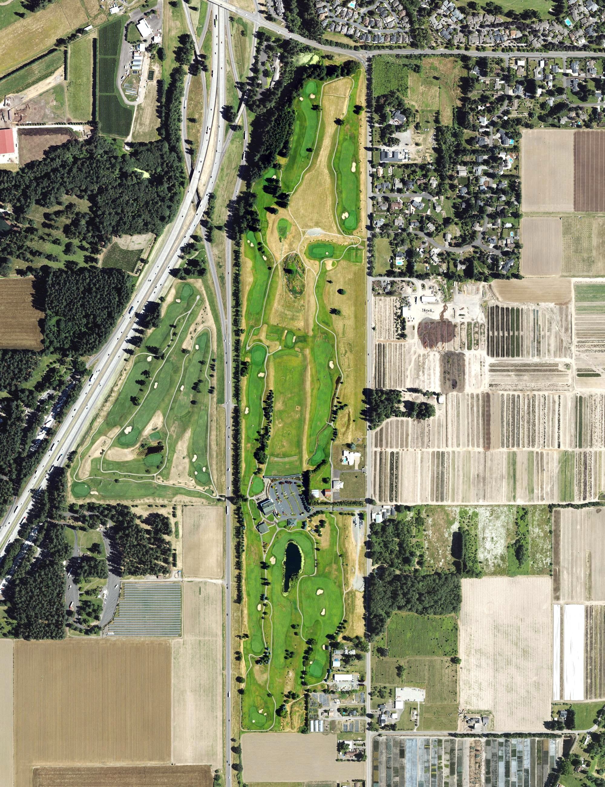 Aerial view of Langdon Farms Golf Course, OR, with its hole routing marked