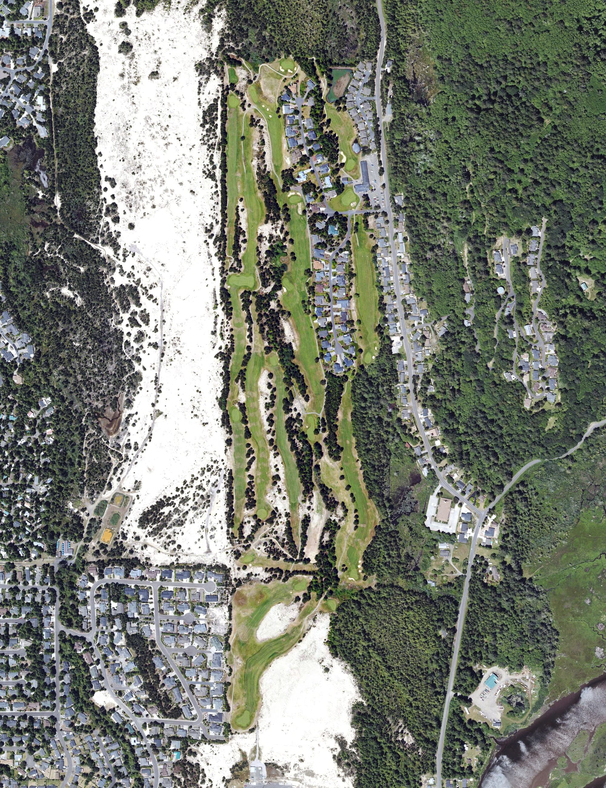 Aerial view of Ocean Dunes Golf Links, OR, with its hole routing marked