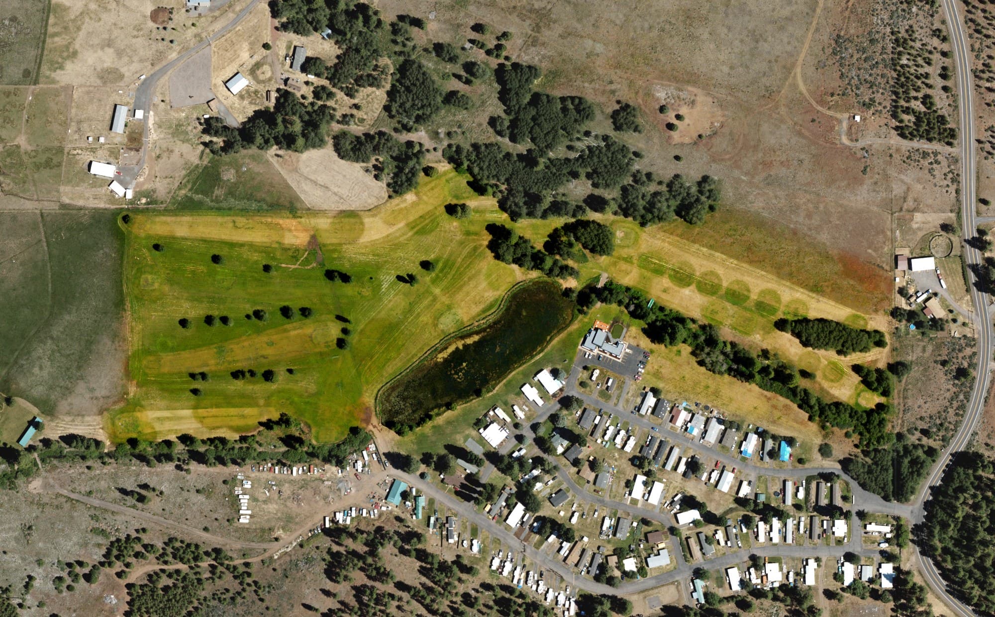 Aerial view of Round Lake Golf Course, OR, with its hole routing marked