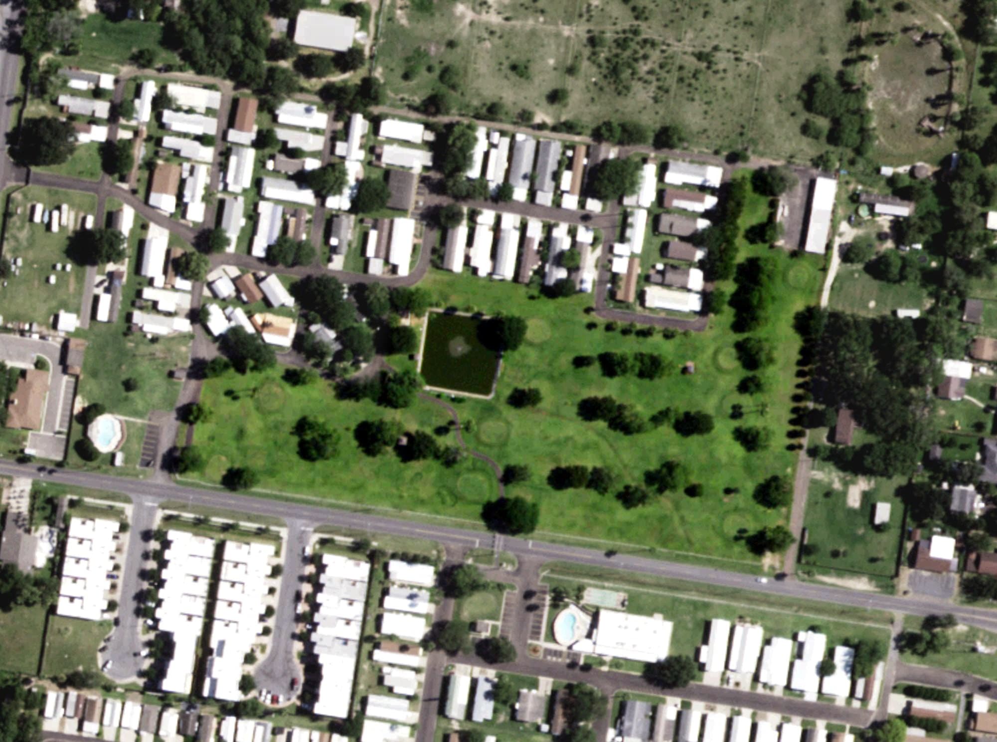 Aerial view of Adobe Wells Golf Course, TX, with its hole routing marked