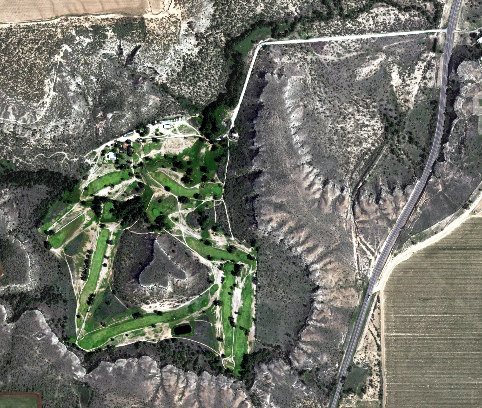 Aerial view of Floydada Country Club, TX, with its hole routing marked
