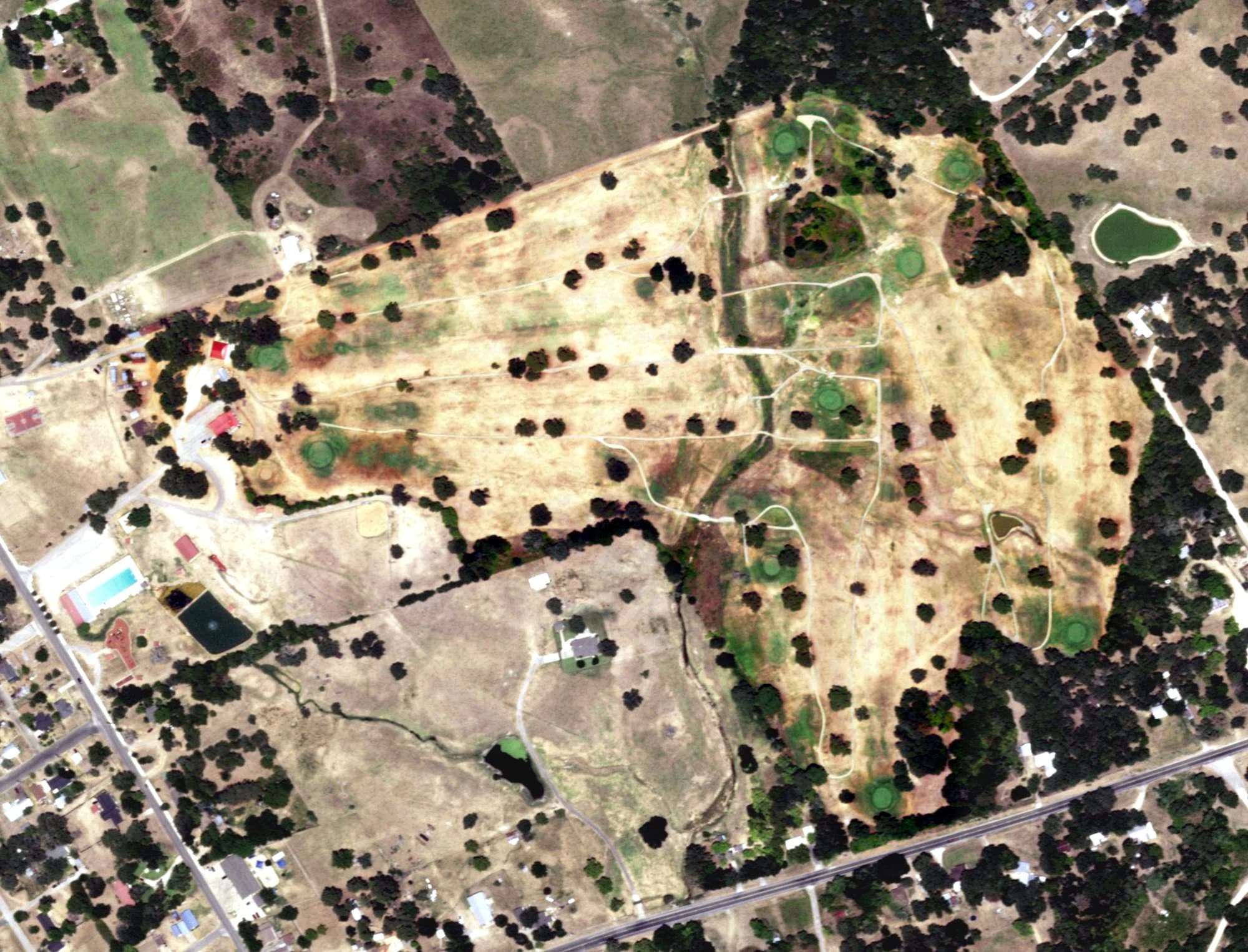 Aerial view of Hearne Municipal Golf Course, TX, with its hole routing marked