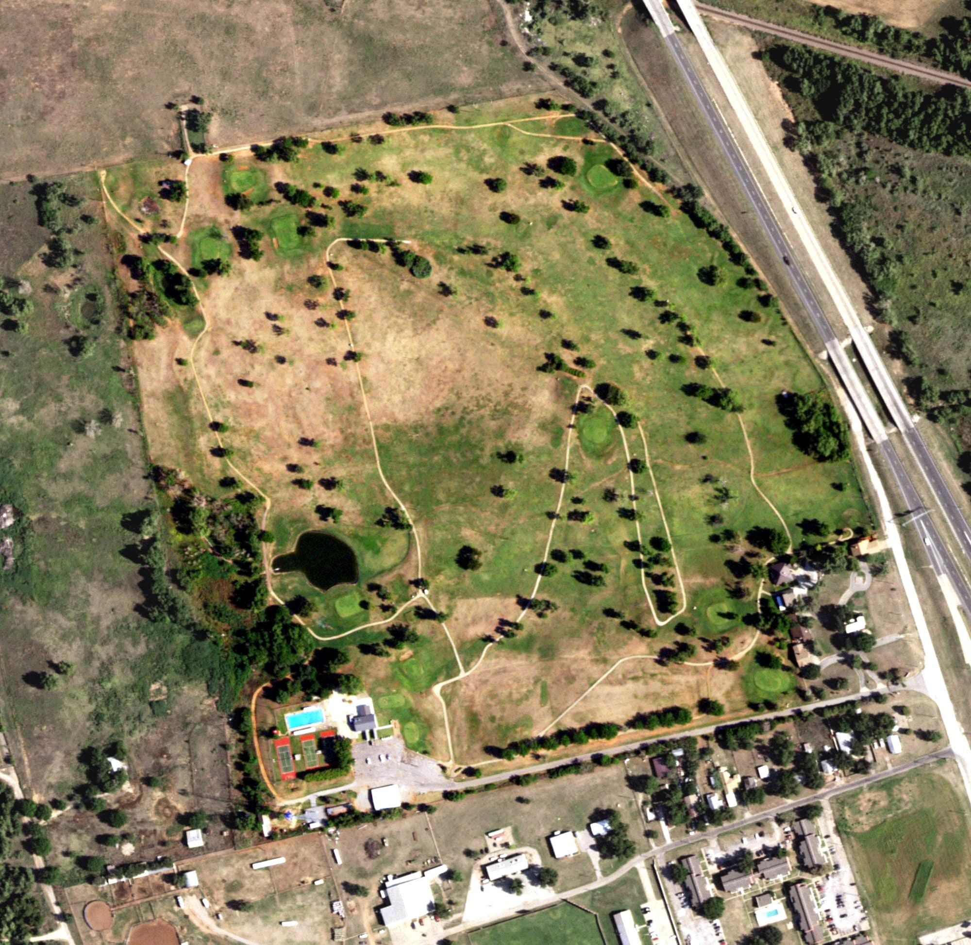 Aerial view of Hillcrest Country Club, TX, with its hole routing marked