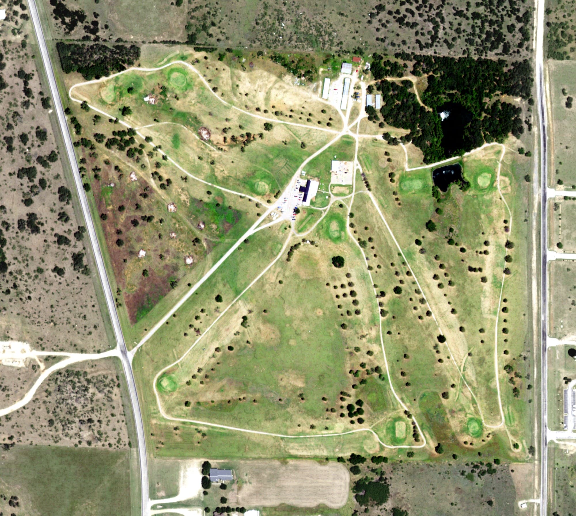Aerial view of Jacksboro Country Club, TX, with its hole routing marked