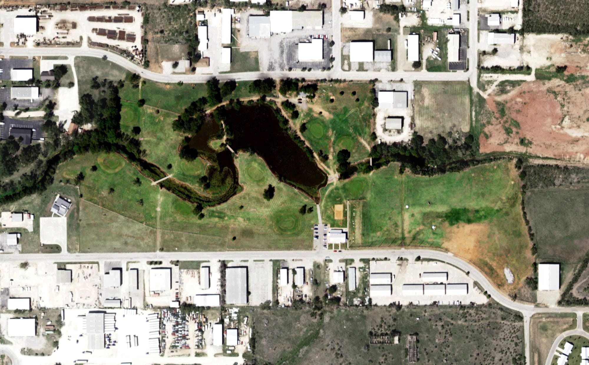Aerial view of Mulligans Par 3 Golf Course, TX, with its hole routing marked