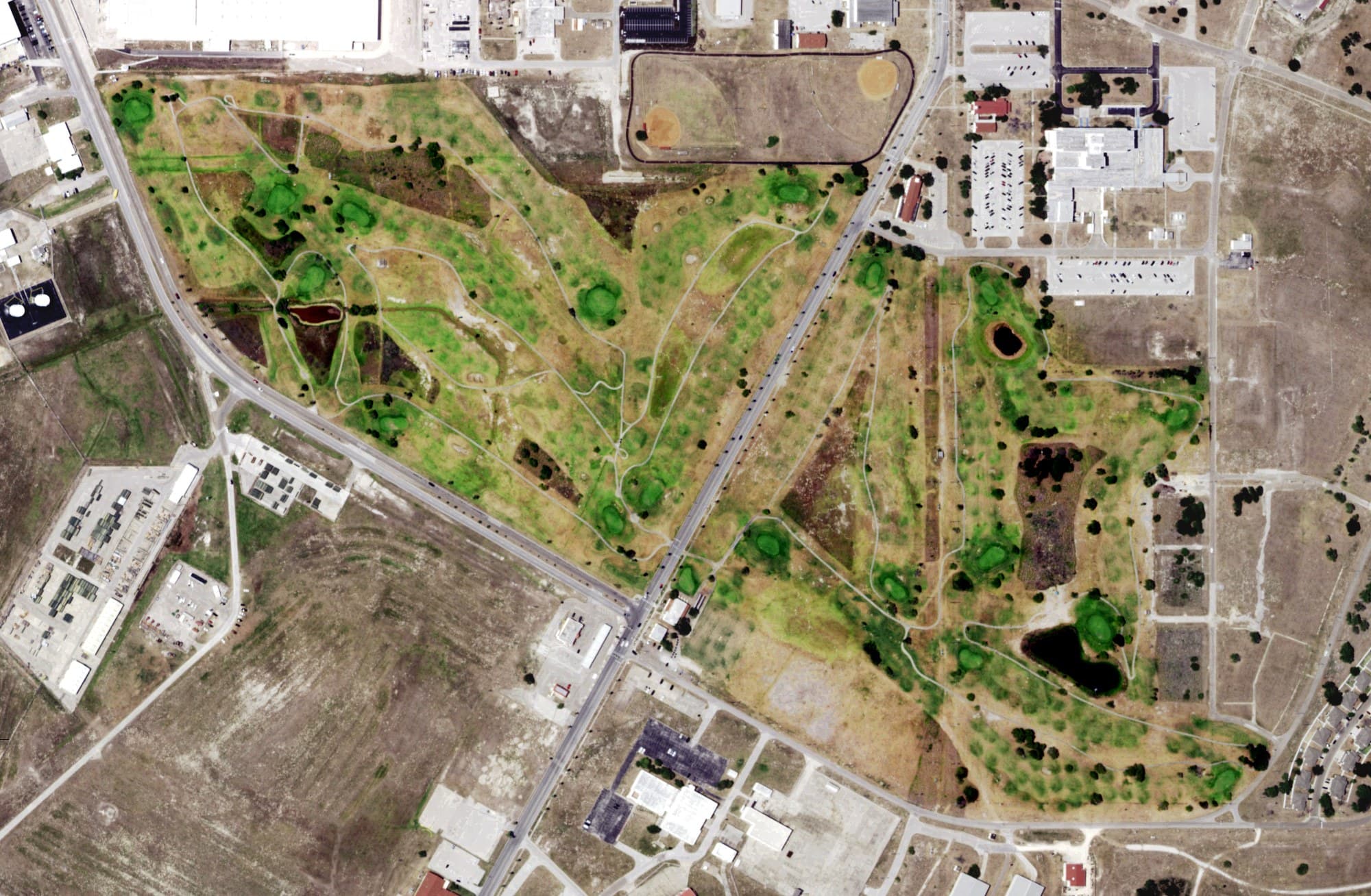 Aerial view of Naval Air Station Golf Course, TX, with its hole routing marked