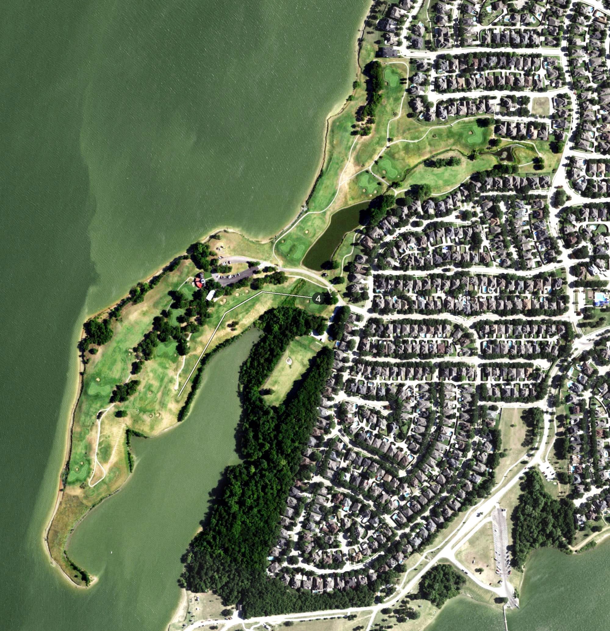 Aerial view of Stewart Peninsula Golf Course, TX, with its hole routing marked