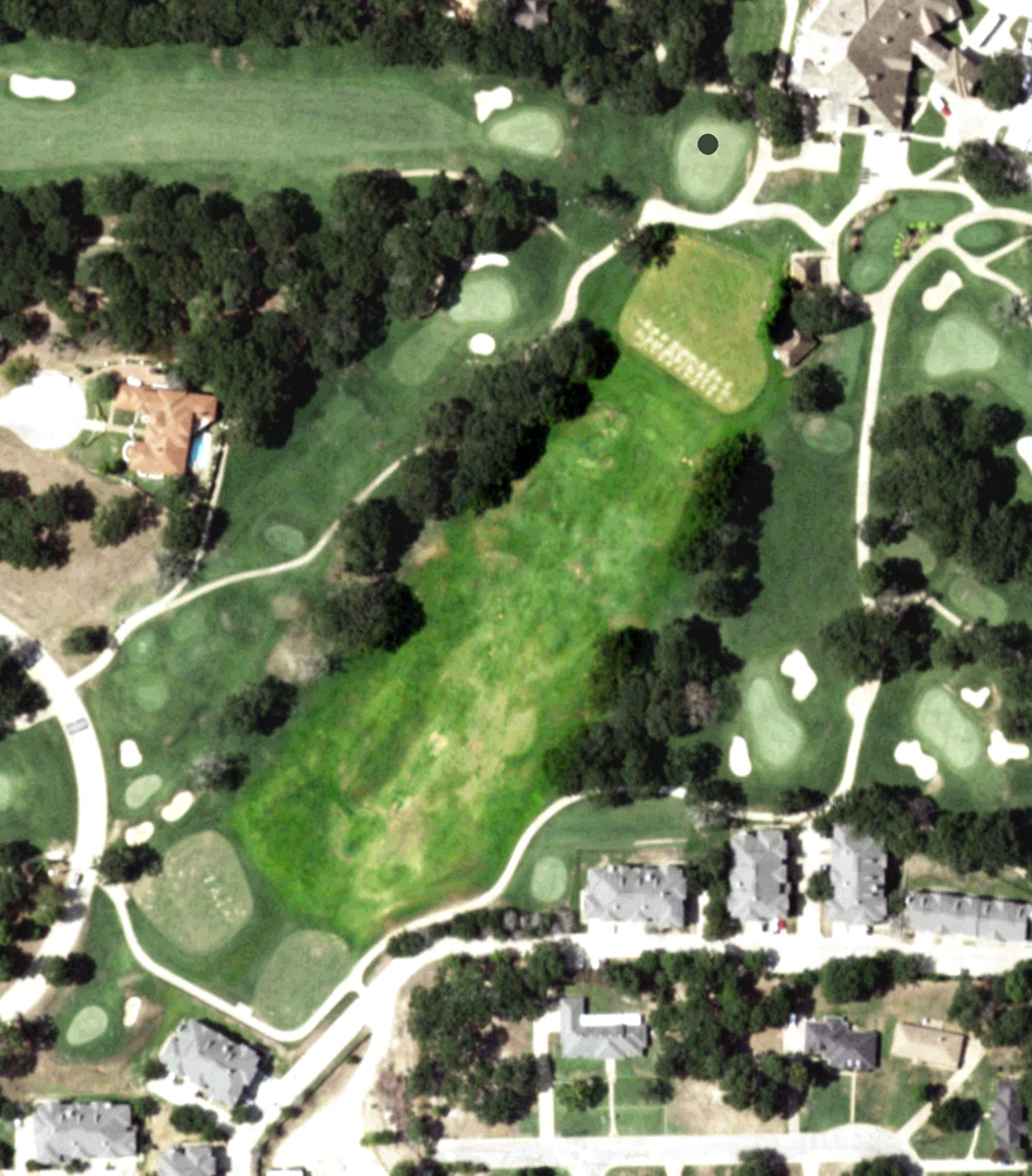 Aerial view of The Cascades Driving Range, TX, with its hole routing marked