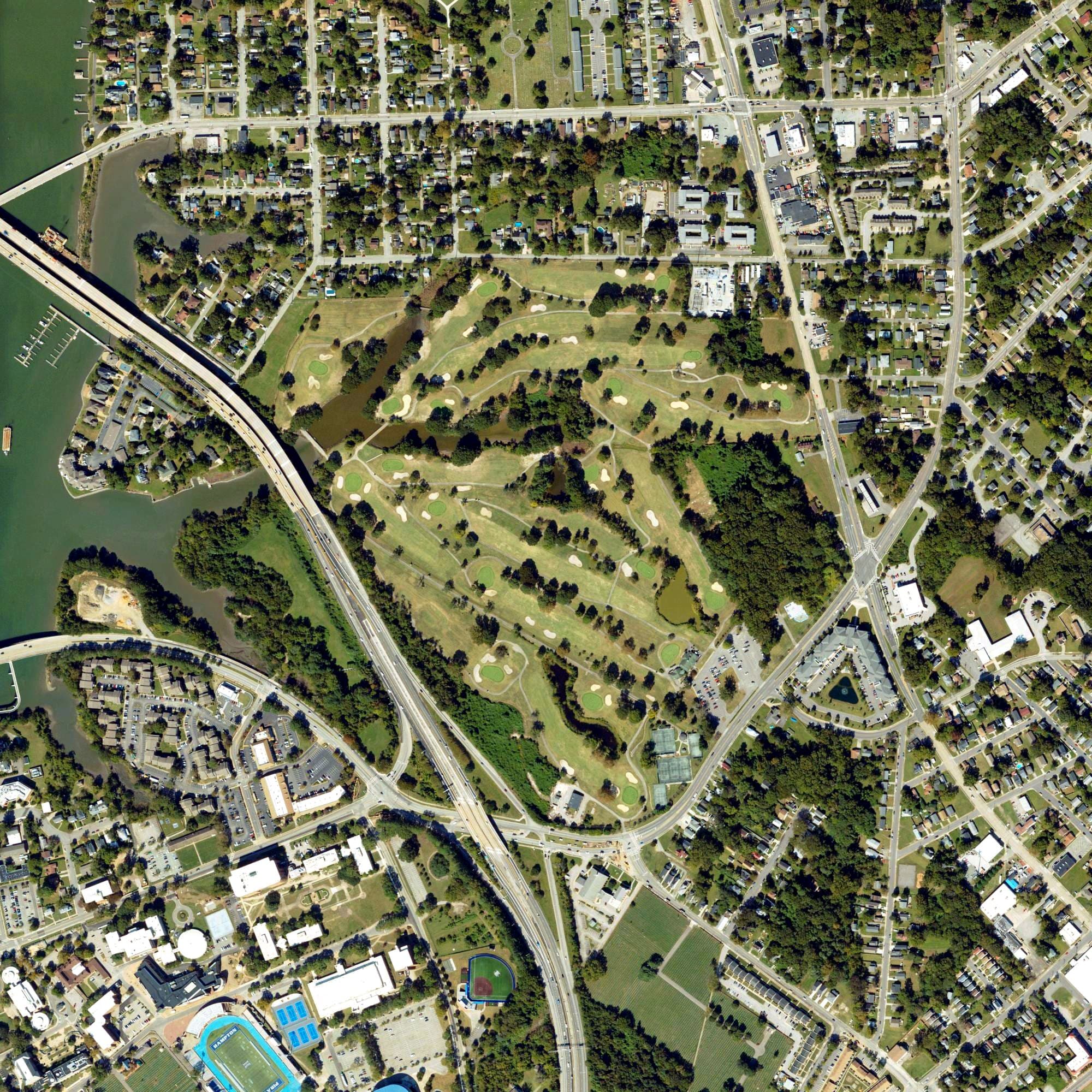 Aerial view of The Woodlands Golf Course, VA, with its hole routing marked