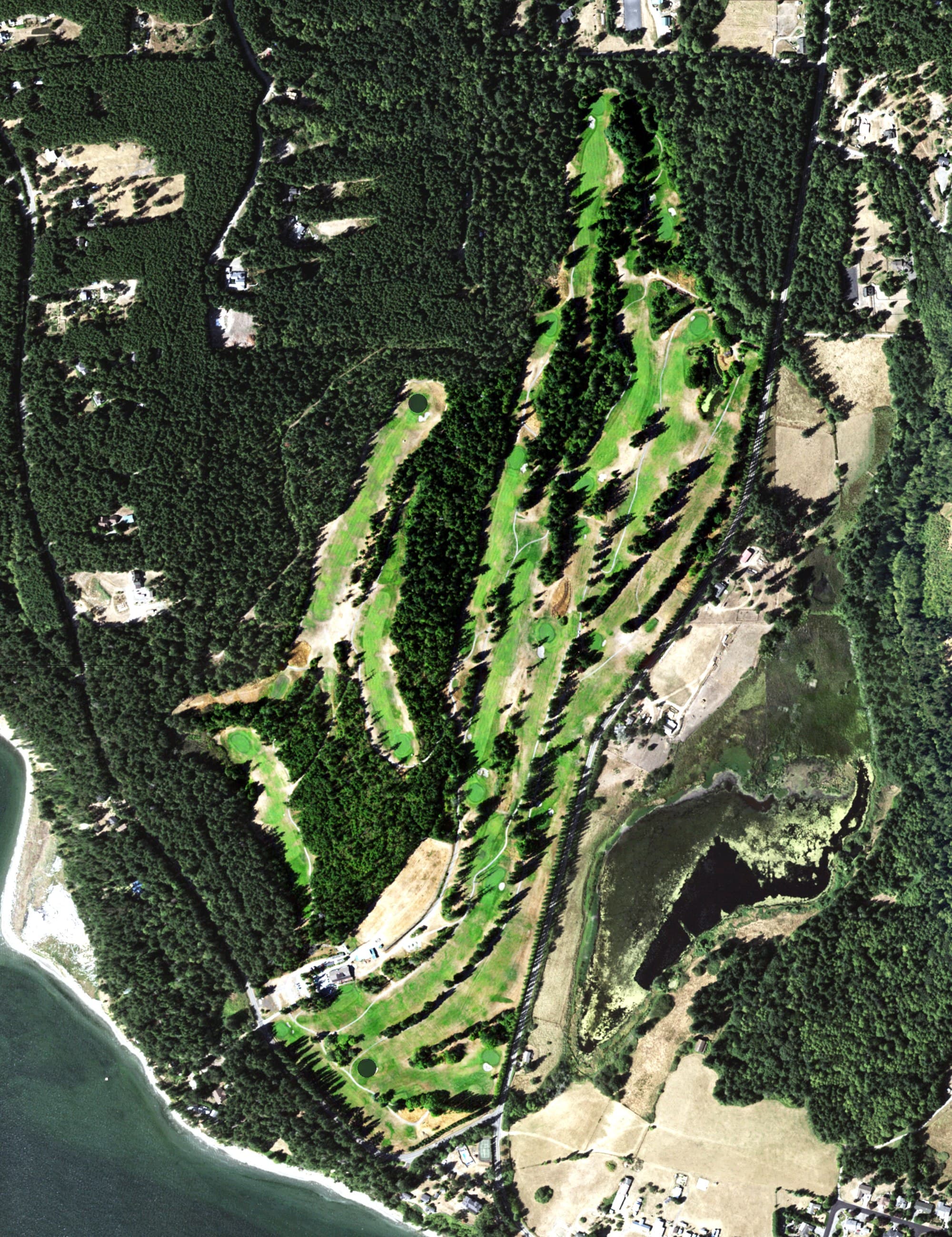 Aerial view of Discovery Bay Golf Course, WA, with its hole routing marked
