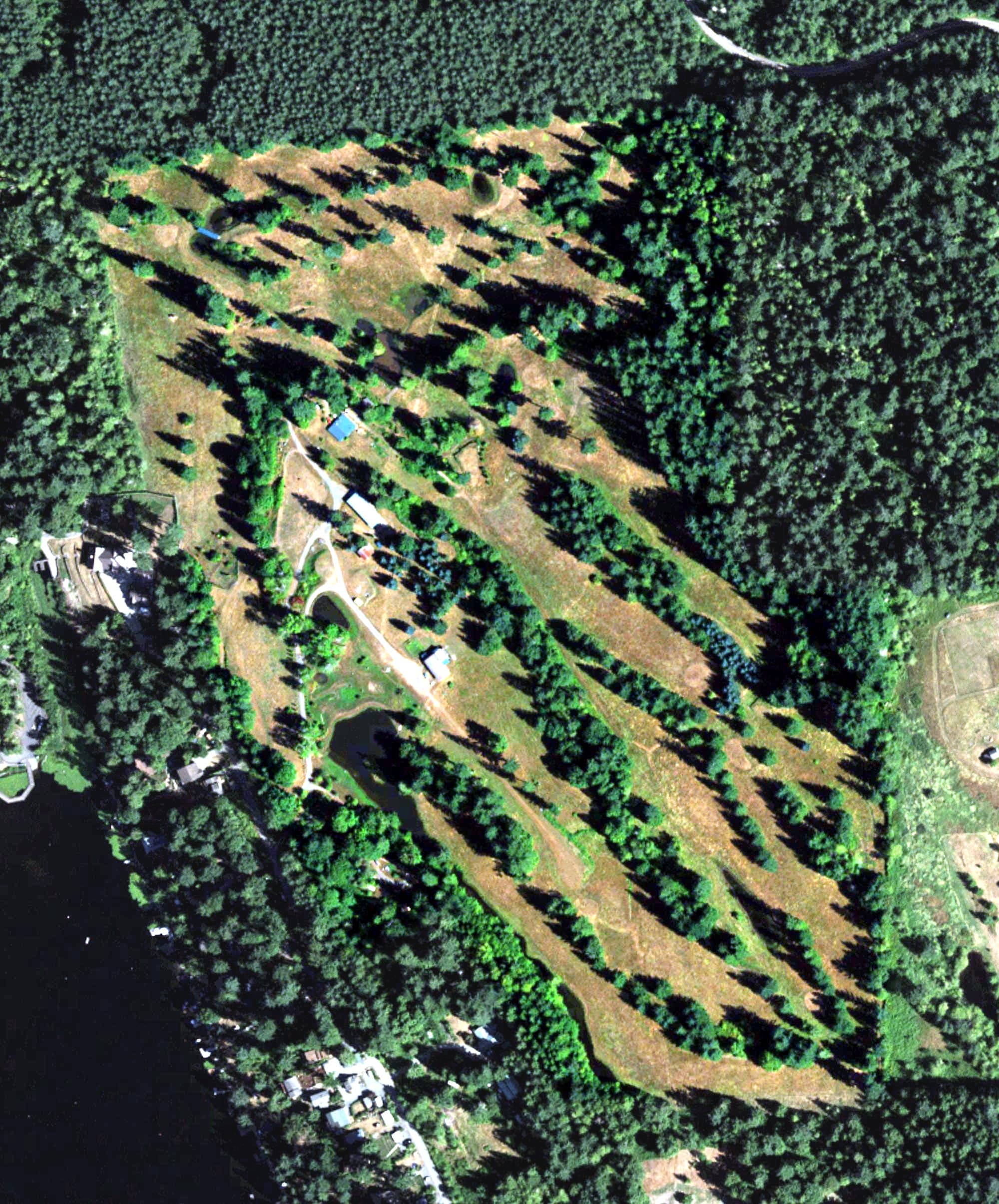 Aerial view of Flowing Lake Golf Course, WA, with its hole routing marked