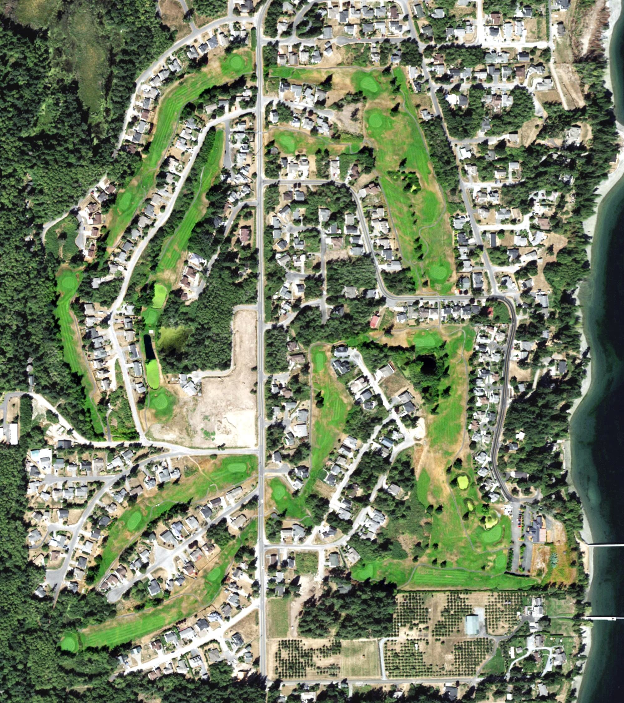 Aerial view of Holmes Harbor Golf Course, WA, with its hole routing marked