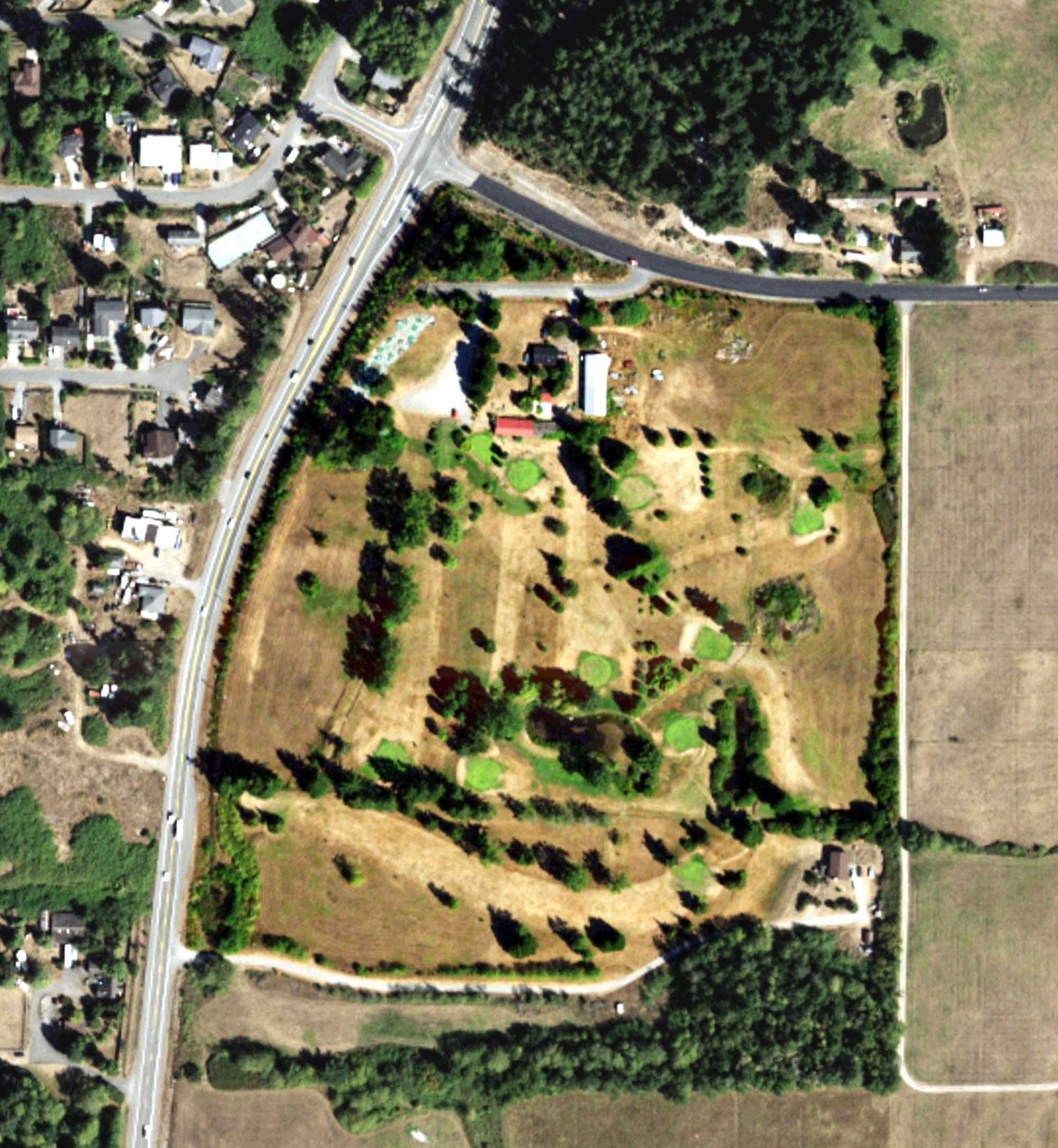 Aerial view of Lam's Golf Links, WA, with its hole routing marked