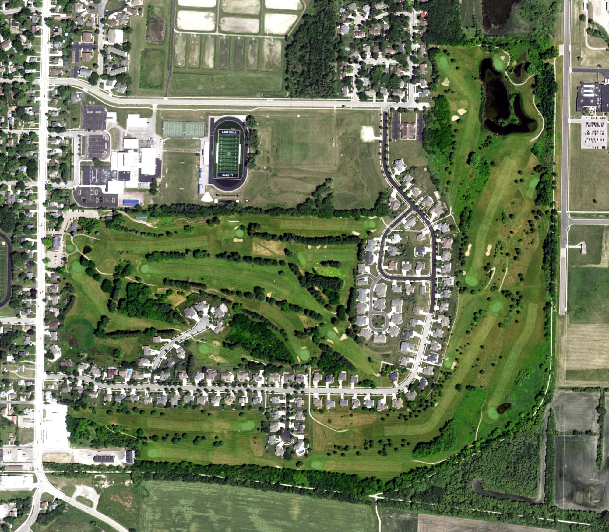 Aerial view of Lake Mills Golf Course, WI, with its hole routing marked